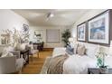 Beautifully decorated bedroom with wood floors and stylish furniture at 2480 W Caithness Pl # 5, Denver, CO 80211