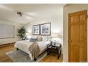 Bright bedroom featuring a cozy rug, nightstands and stylish decor at 2480 W Caithness Pl # 5, Denver, CO 80211