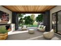 Cozy outdoor seating area with a fireplace, TV, and a view of lush greenery at 1721 Arrowpoint Ct, Franktown, CO 80116