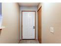 Bright entryway with neutral walls, carpet, closet, and white door at 2690 E Otero Pl # 7, Centennial, CO 80122