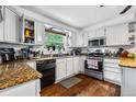 Bright kitchen with stainless steel appliances, granite counters, and lots of natural light at 2730 S Jay St, Denver, CO 80227