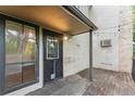 Spacious outdoor back porch with lighting and plenty of room for entertaining at 3550 S Harlan St # 105, Denver, CO 80235