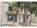 Charming two-story townhome with well-maintained siding and a welcoming entrance at 3550 S Harlan St # 105, Denver, CO 80235