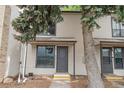 Inviting townhome with neutral siding and ample natural light streaming through large windows at 3550 S Harlan St # 105, Denver, CO 80235