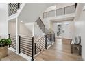 Beautiful staircase featuring a modern black railing and lots of natural light at 6851 Copper Sky Cir, Castle Pines, CO 80108