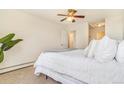 Spacious bedroom features a comfortable bed, neutral walls and a doorway to additional rooms at 2231 S Vaughn Way # 317 B, Aurora, CO 80014