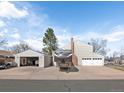 Features a detached garage and RV parking and a well-maintained lawn at 4391 S Tabor Ct, Morrison, CO 80465