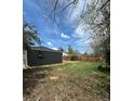Large backyard with grass and a wooden fence, perfect for outdoor activities and privacy at 1100 N Hanover St, Aurora, CO 80010