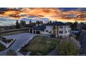 Magnificent home with a grand entrance, complemented by a large driveway and professional landscaping at 15902 W 64Th Ave, Arvada, CO 80007