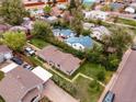 This aerial view shows a single-story home in a neighborhood with alley access and compact backyard at 2258 S Galapago St, Denver, CO 80223