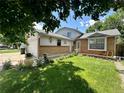 Lovely home with brick accents, lush lawn, and charming curb appeal at 45 Pierce St, Lakewood, CO 80226