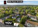 Aerial view showcasing the property's location in Olde Town Arvada surrounded by lush greenery and neighborhood streets at 6801 W 52Nd Ave, Arvada, CO 80002