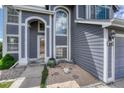 Well-maintained front entrance, enhanced with sand and stone garden, inviting curb appeal at 3630 Sawgrass Trl, Castle Rock, CO 80109