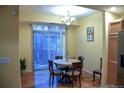 Charming dining room with hardwood floors and access to a balcony at 18766 E Yale Cir # A, Aurora, CO 80013