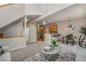 Open-concept living space featuring a seamless flow into the dining and kitchen areas at 225 Longspur Dr, Brighton, CO 80601