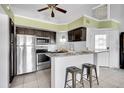 Modern kitchen with stainless steel appliances and granite countertops at 11109 Alcott St # D, Westminster, CO 80234