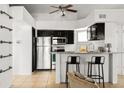 Contemporary kitchen with stainless steel appliances and granite countertops with barstool seating at 11109 Alcott St # D, Westminster, CO 80234