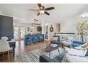 Inviting living room showcasing hardwood floors, modern furnishings, and a cozy atmosphere at 18355 W 59Th Dr, Golden, CO 80403