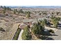 Stunning aerial view of home with mountain views, mature trees, and beautiful landscaping at 2116 Ridgetrail Dr, Castle Rock, CO 80104