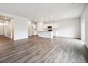 Large open floor plan showcasing the kitchen and living area, perfect for entertaining at 2186 Flower Blossom Ave, Brighton, CO 80601