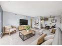 Inviting living room featuring stylish furniture, large TV, and an open layout at 190 E Highline Cir # 302, Centennial, CO 80122