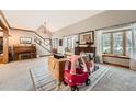 Bright, airy living room with large windows, a piano, and open floor plan perfect for Gathering gatherings at 15395 E Penwood Pl, Aurora, CO 80015