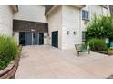 Inviting building entrance with well-maintained landscaping and comfortable seating at 5995 E Iliff-1 Ave # 309, Denver, CO 80222