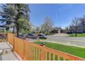 Inviting front porch with a view of the street and neighboring homes, perfect for relaxing outdoors at 141 S Knox Ct, Denver, CO 80219