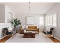 Stylish living room with a large window, comfortable seating, and a modern coffee table at 2140 Santa Fe Dr, Longmont, CO 80504