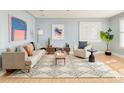 Bright living room with hardwood floors, comfortable seating, and stylish decor at 2972 Kearney St, Denver, CO 80207