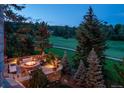 Stunning aerial view of backyard with fire pit and lounge seating; ideal for entertaining guests at 77 Comstock Pl, Castle Rock, CO 80108