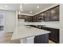 Bright, modern kitchen features sleek countertops, stainless steel appliances, and ample cabinet space at 7241 Goldbloom Ln, Littleton, CO 80125