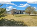 A charming home with well-maintained lawn and landscaping, offering inviting curb appeal and a tranquil setting at 56330 E 37Th Ct, Strasburg, CO 80136
