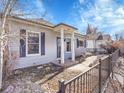 Charming single-story home with blue trim and landscaped front yard at 5920 S Bemis St, Littleton, CO 80120