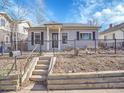 Inviting single-story home with fenced front yard and tidy landscaping at 5920 S Bemis St, Littleton, CO 80120