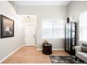 Inviting living area featuring hardwood floors, a display case, and a large window, offering plenty of natural light at 9481 Longstone Dr, Parker, CO 80134