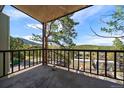 A balcony view overlooking nature, trees and a home during daytime at 31270 John Wallace Rd # 310, Evergreen, CO 80439