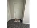 An interior view of a front door with a welcome mat at 31270 John Wallace Rd # 310, Evergreen, CO 80439