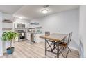 Bright kitchen features stainless steel appliances, gray granite countertops, and a wooden table with chairs at 5300 E Cherry Creek South Dr # 804, Denver, CO 80246