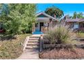 Charming exterior of a brick home with a welcoming front porch and steps at 3336 N Saint Paul St, Denver, CO 80205