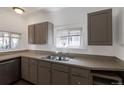 Functional kitchen featuring ample counter space, cabinets, and double basin stainless steel sink at 3336 N Saint Paul St, Denver, CO 80205