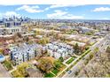 Stunning aerial view of townhomes, landscaping and Denver's cityscape in the distance at 2726 Federal Blvd # 1, Denver, CO 80211