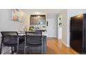 Modern kitchen featuring stainless steel appliances, an island with seating, and sleek cabinetry at 789 N Clarkson St # 906, Denver, CO 80218