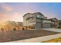 Beautiful two-story home with a two car garage, stone accents, and a landscaped front yard in a quiet neighborhood at 1845 Meagan Way, Erie, CO 80516