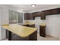 Kitchen featuring ample counter space with a window providing natural light at 2832 S Mobile St, Aurora, CO 80013