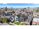 An aerial view of the property, neighborhood, and the Denver skyline in the background at 3725 N Franklin St, Denver, CO 80205
