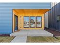 Close-up of the welcoming entryway, showcasing the wood accents and modern design elements at 3725 N Franklin St, Denver, CO 80205