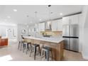 Bright, spacious kitchen with stainless steel appliances, a large island, and modern pendant lighting at 3725 N Franklin St, Denver, CO 80205