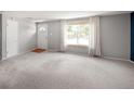 Bright living room with new carpet, neutral paint, and lots of natural light at 6353 W 78Th Ave, Arvada, CO 80003
