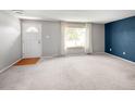 Spacious living room with new carpet, neutral paint, and lots of natural light at 6353 W 78Th Ave, Arvada, CO 80003